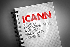 ICANN - Internet Corporation for Assigned Names and Numbers acronym on notepad, technology concept background