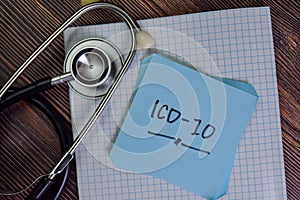 ICD-10 write on sticky notes isolated on Wooden Table