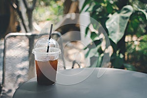 Ice americano coffee in garden cafe