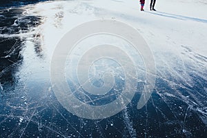 Ice background. ice surface texture with skaters