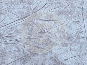 Ice background with marks from skating and hockey.