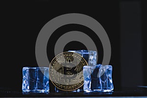 Ice and bitcoin coin. Freezing of cryptocurrency accounts. Frozen bitcoin coin.