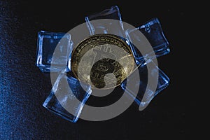 Ice and bitcoin coin. Freezing of cryptocurrency accounts. Frozen bitcoin coin.