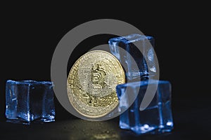 Ice and bitcoin coin. Freezing of cryptocurrency accounts. Frozen bitcoin coin.