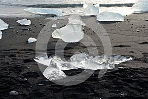 Ice on the black sand beach nearby the most visited JÃ¶kulsarlon glacier lagoon