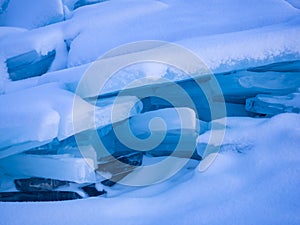 Ice blocks covered with snow at Frozen Lake Baikal