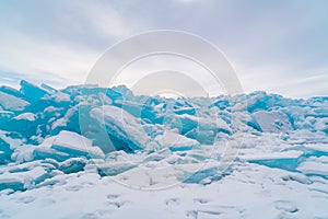 Ice blocks covered with snow in Lake Baikal