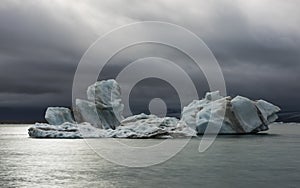 Ice Blocks and dark Clouds at the Jokulsarlon Lake, Iceland