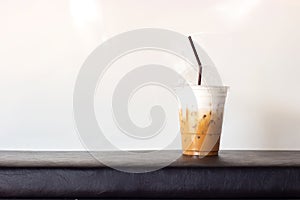 Ice cappuccino in plastic cup. On white background with copy spa