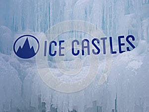 Ice castles sign at an icy winter attraction