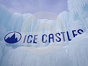 Ice castles sign at an icy winter attraction