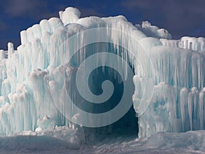 Ice Cave Entrance Against A Blue Sky