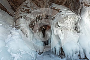 Ice cave, Icicles in the rocky caves, Lake Baikal in winter, Siberia