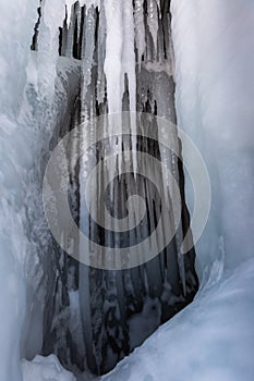 Ice cave, Icicles in the rocky caves, Lake Baikal in winter, Siberia