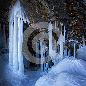 Ice cave, Icicles in the rocky caves, Lake Baikal in winter, Siberia