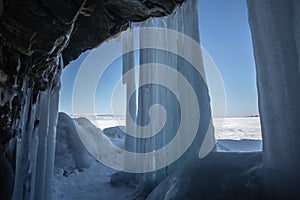 Ice cave, Icicles in the rocky caves, Lake Baikal in winter, Siberia