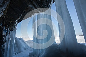 Ice cave, Icicles in the rocky caves, Lake Baikal in winter, Siberia