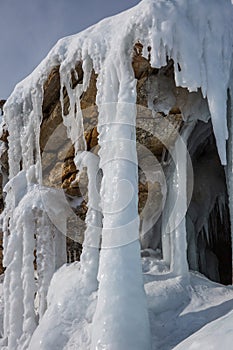 Ice cave, Icicles in the rocky caves, Lake Baikal in winter, Siberia