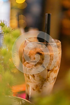 ice choco coffee caramel with straw and spoon