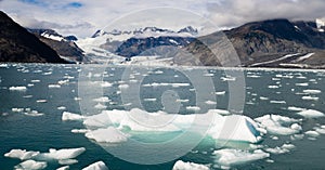 Ice Chunks Dwarfed by Mountains Aialik Glacier Alaska Kenia Fjords photo