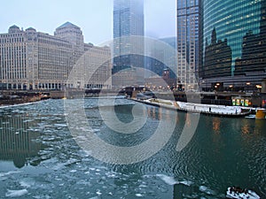 Ice chunks float on the Chicago River on a foggy morning in January.