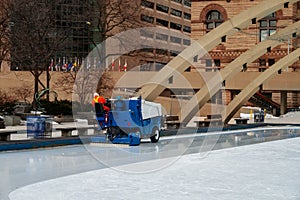 Ice cleaning machine servicing rink in Toronto downtown square