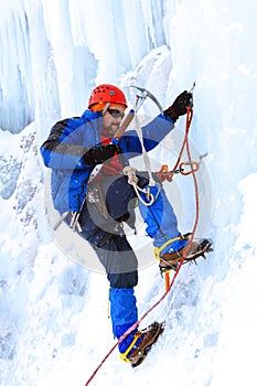 Ice climber climbing a glacier