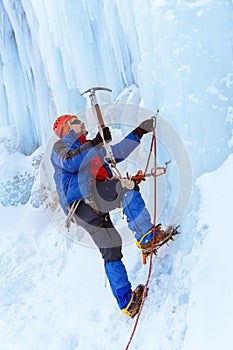 Ice climber climbing a glacier