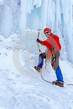 Ice climber climbing a glacier