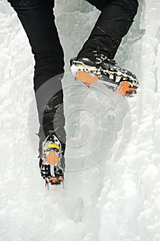 An ice climber on a frozen waterfall