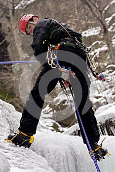 Ice climber rappelling