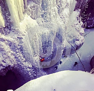 Ice climbers digging in with their ice picks and crampons as the