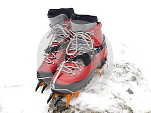 Ice climbing boots and crampons photo