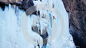 Ice climbing at frozen waterfall.