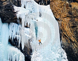 Ice climbing at frozen waterfall