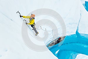 Ice climbing out of a canoe on the Matanuska Glacier