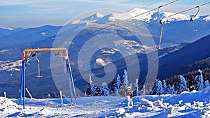 Ice-coated ski lift in carpathian mountain.