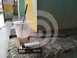 Ice coffe with cigaret