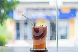Ice coffee, americano coffee with orange in cafe