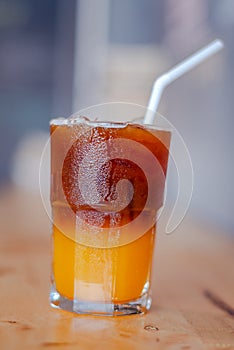 Ice coffee, americano coffee with orange in cafe