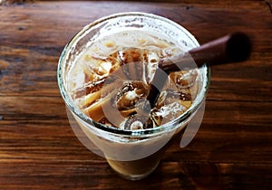 ice coffee in glass and brown tube