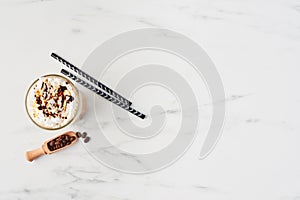 Ice coffee in white marble background