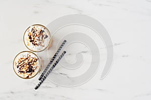 Ice coffee in white marble background