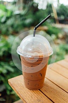 Ice coffee on a wooden table