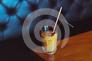 Ice coffee on a wooden table
