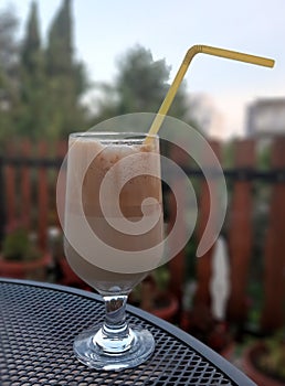 Ice cold Coffee. Ice Coffee in a Bar Glass.