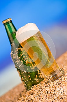 Ice cold green unlabelled bottle of beer in the