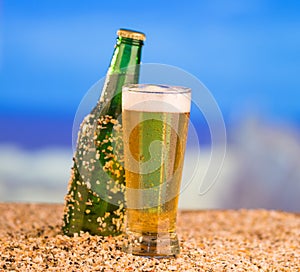 Ice cold green unlabelled bottle of beer in the