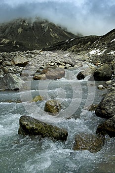 Ice cold Lachung river flowing out of glacier at Yumesamdong, Zero point, Sikkim, India. Altitude of 15,300 feet, last outpost of