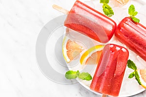 Ice cold refreshing red popsicles